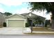 Charming single-Gathering home with a two-car garage and well-manicured landscaping, showcasing curb appeal at 146 Essex Pl, Davenport, FL 33896