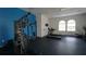 Modern gym with weight machines, treadmills, and fitness equipment for a complete workout experience at 146 Essex Pl, Davenport, FL 33896
