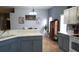 Open concept eat-in kitchen with tile flooring, gray cabinets, and white countertops at 146 Essex Pl, Davenport, FL 33896