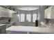 Eat-in kitchen area with a glass table set, gray cabinets, and white countertops at 146 Essex Pl, Davenport, FL 33896