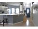 Bright kitchen with breakfast bar, an open layout, stainless appliances, and convenient access to the dining area at 146 Essex Pl, Davenport, FL 33896