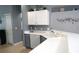 Modern kitchen with white countertops and gray lower cabinets at 146 Essex Pl, Davenport, FL 33896