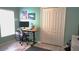 Home office featuring a modern computer setup, ample storage and natural light at 146 Essex Pl, Davenport, FL 33896