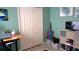 Office area with work area and storage cabinets at 146 Essex Pl, Davenport, FL 33896