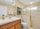 Bright bathroom with a glass enclosed shower, modern fixtures and artistic decor at 1561 Loris Loop, The Villages, FL 32162