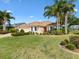 Charming home with a well-manicured lawn, lush landscaping and curb appeal at 1561 Loris Loop, The Villages, FL 32162