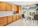 Well-lit kitchen nook with lovely window views, bright cabinetry, and modern finishes at 1561 Loris Loop, The Villages, FL 32162