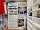Custom walk-in closet with built-in shelves and hanging rods for optimal storage at 1561 Loris Loop, The Villages, FL 32162