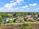 Aerial view of a home in a lush neighborhood featuring well-maintained landscaping at 1723 Carrera Dr, The Villages, FL 32159