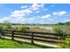 Scenic view from the backyard featuring a serene pond and lush greenery at 1723 Carrera Dr, The Villages, FL 32159