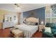 Comfortable main bedroom featuring a ceiling fan, hardwood floors and natural light at 1723 Carrera Dr, The Villages, FL 32159