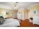 Spacious main bedroom featuring hardwood floors, crown molding and lots of storage at 1723 Carrera Dr, The Villages, FL 32159
