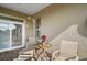 Cozy outdoor patio with brick floor, patio table with chairs, and sliding glass door access at 1723 Carrera Dr, The Villages, FL 32159