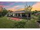 Expansive backyard showcasing a screened lanai and patio, perfect for outdoor entertaining at 179 Patrice Hope St, Leesburg, FL 34748