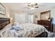 Bedroom with ceiling fan and seashell bedding at 179 Patrice Hope St, Leesburg, FL 34748