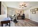Bedroom with desk, exercise bike, and closet at 179 Patrice Hope St, Leesburg, FL 34748