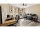 Bedroom with wood-look floors, natural light, and two desks at 179 Patrice Hope St, Leesburg, FL 34748