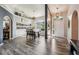 Open-concept entryway featuring hardwood floors, natural light, and decorative shelving at 179 Patrice Hope St, Leesburg, FL 34748