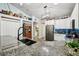 Kitchen features granite countertops, stainless appliances, white cabinets, dark sink and decoratively-shelved vaulted ceiling at 179 Patrice Hope St, Leesburg, FL 34748