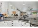 Spacious kitchen with granite counters, stainless steel appliances, and stylish décor at 179 Patrice Hope St, Leesburg, FL 34748