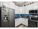 Modern kitchen featuring stainless steel refrigerator and appliances at 179 Patrice Hope St, Leesburg, FL 34748