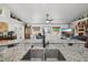 Open kitchen with a double sink and beautiful granite countertops at 179 Patrice Hope St, Leesburg, FL 34748