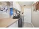 Laundry room with countertop, cabinets, and washer dryer at 179 Patrice Hope St, Leesburg, FL 34748