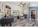 Cozy living room with hardwood floors and modern furniture at 179 Patrice Hope St, Leesburg, FL 34748