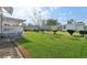 Expansive backyard with lush green grass and mature trees at 1901 Brookside Dr, Mount Dora, FL 32757