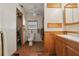 Neutral bathroom featuring a single sink vanity, toilet and a ceiling fan at 1901 Brookside Dr, Mount Dora, FL 32757