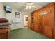 A bedroom featuring a built-in wooden cabinet and adjacent open doorway at 1901 Brookside Dr, Mount Dora, FL 32757