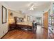 Spacious bedroom with a large wooden bed frame and laminate wood flooring at 1901 Brookside Dr, Mount Dora, FL 32757