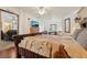 Bright bedroom featuring wood floors, ceiling fan, dresser and desk at 1901 Brookside Dr, Mount Dora, FL 32757