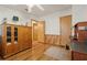 A bright bedroom with wood flooring, closet, and a dresser at 1901 Brookside Dr, Mount Dora, FL 32757