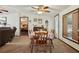 Dining room with table, chairs, and natural light from a large window at 1901 Brookside Dr, Mount Dora, FL 32757