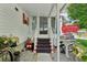 Charming front porch with decorative accents and a welcoming entrance at 1901 Brookside Dr, Mount Dora, FL 32757