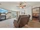 Comfortable living room with a fireplace, sliding glass doors, and an open feel at 1901 Brookside Dr, Mount Dora, FL 32757