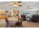 Open living space featuring a dining area, kitchen, and living room with a fireplace at 1901 Brookside Dr, Mount Dora, FL 32757