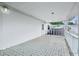 Large covered porch with patterned tile flooring; ideal for outdoor living at 1901 Brookside Dr, Mount Dora, FL 32757