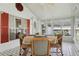 Sunroom featuring tile floors, a ceiling fan, and multiple windows, creating a cozy atmosphere at 1901 Brookside Dr, Mount Dora, FL 32757