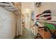 Walk-in closet with wire shelving and storage space; ideal for organizing belongings at 1901 Brookside Dr, Mount Dora, FL 32757