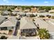 Aerial view of a well-kept neighborhood features cozy homes, green landscaping, and screened patios at 1917 Peachtree Ave, The Villages, FL 32162