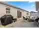 Backyard patio with outdoor seating, a grill, and easy access to indoor-outdoor living at 1917 Peachtree Ave, The Villages, FL 32162