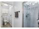Well-lit bathroom features a walk-in shower with tile surround, open toilet area, and neutral paint at 1917 Peachtree Ave, The Villages, FL 32162