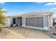 Charming single-story home with a two-car garage and well-maintained landscaping at 1917 Peachtree Ave, The Villages, FL 32162