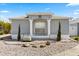 Well-kept single-story home with decorative columns and low-maintenance landscaping at 1917 Peachtree Ave, The Villages, FL 32162