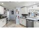 Open concept kitchen with stainless steel dishwasher and granite countertops at 1917 Peachtree Ave, The Villages, FL 32162