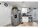 Bright kitchen featuring modern stainless steel appliances and spacious storage at 1917 Peachtree Ave, The Villages, FL 32162
