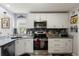 Modern kitchen featuring stainless steel appliances and stylish backsplash at 1917 Peachtree Ave, The Villages, FL 32162