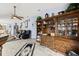Large living room showcasing a big decorative china cabinet and tile floors at 1917 Peachtree Ave, The Villages, FL 32162